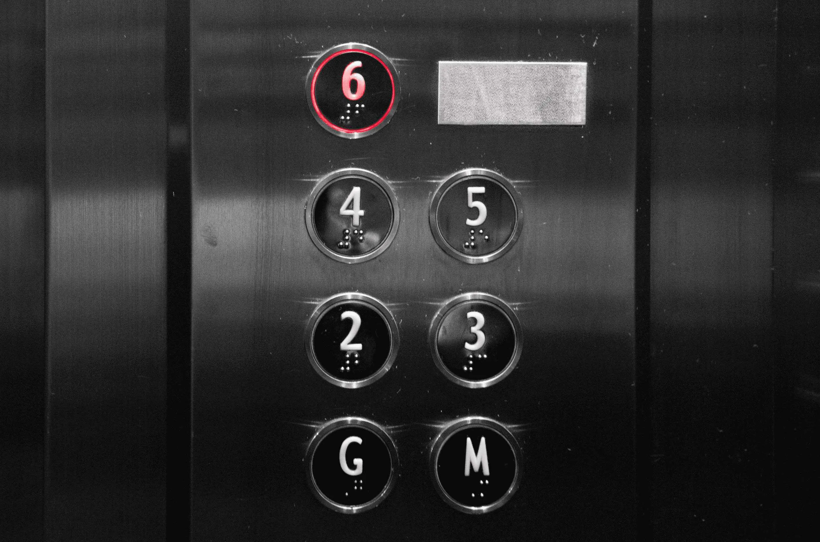 braille on elevator buttons below numbers so that bline people can use it easily