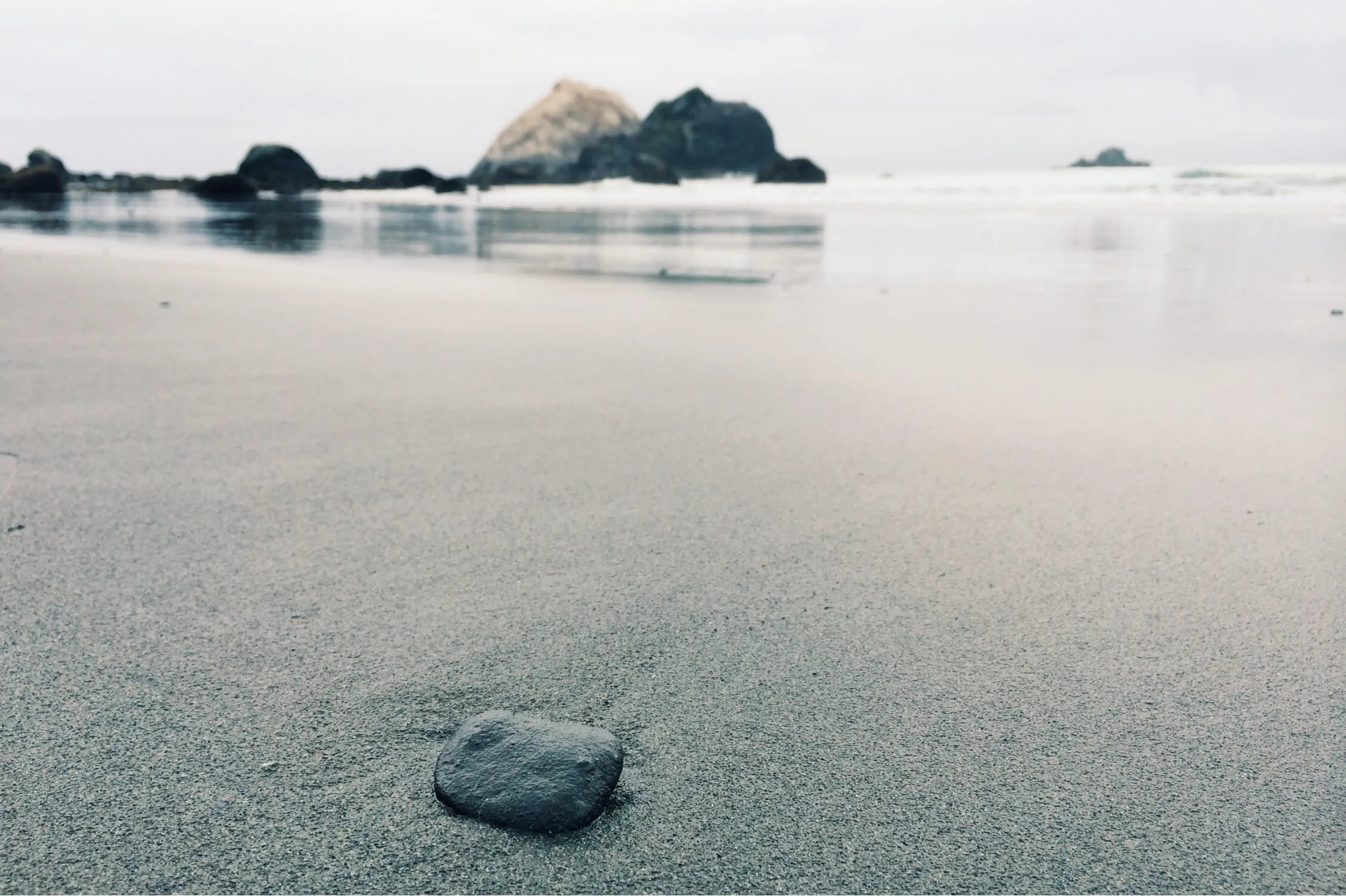 object placed closer to us is the figure, i.e focus which in this case is the stone in the picture